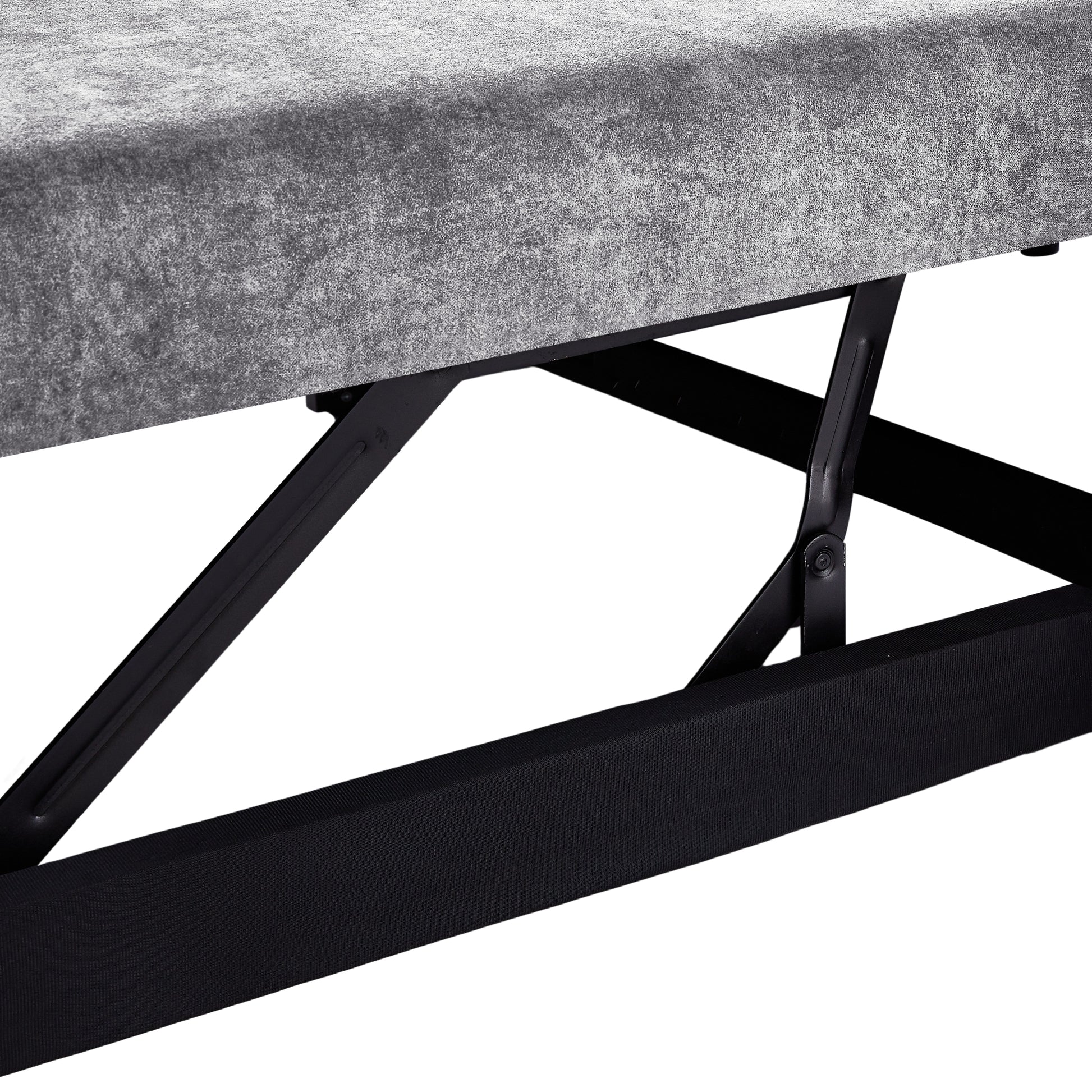 Closeup of gray upholstered bed frame with visible lift mechanism