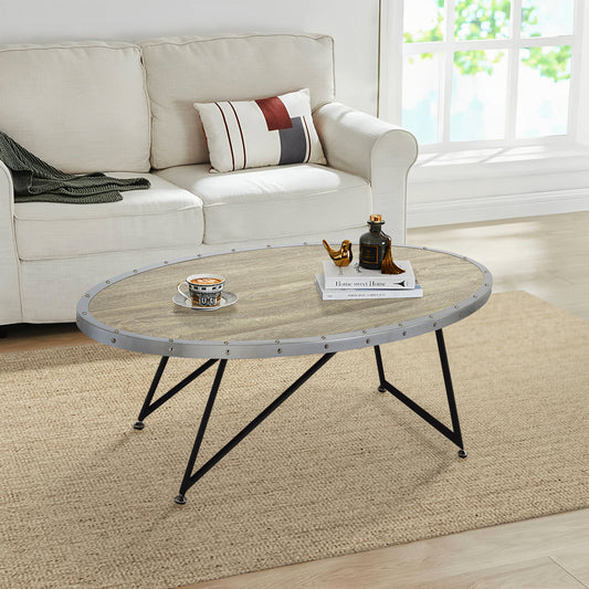 Oval coffee table with distressed wood top and metal trim accents