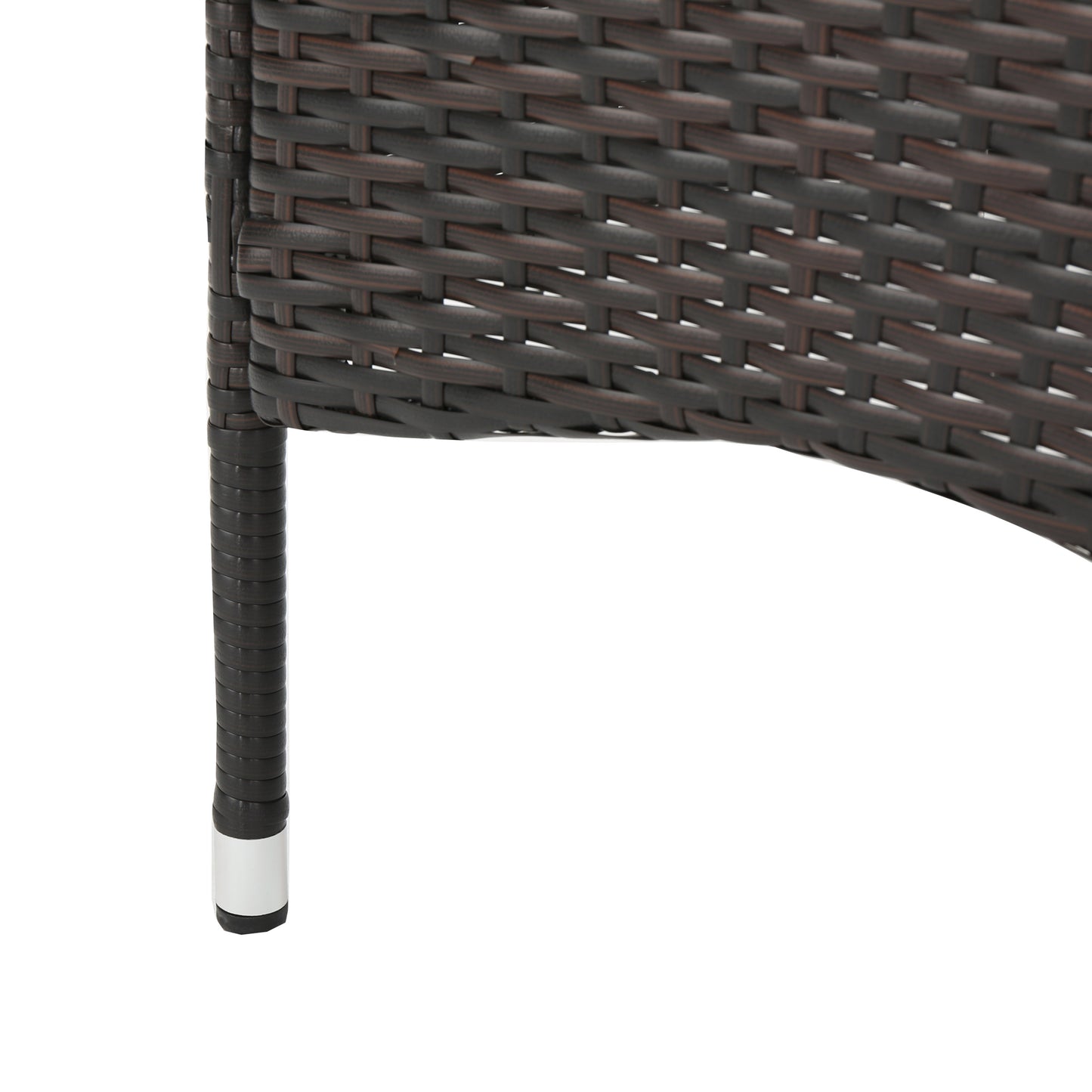 Dark brown rattan weave detail with silver foot caps on chair leg