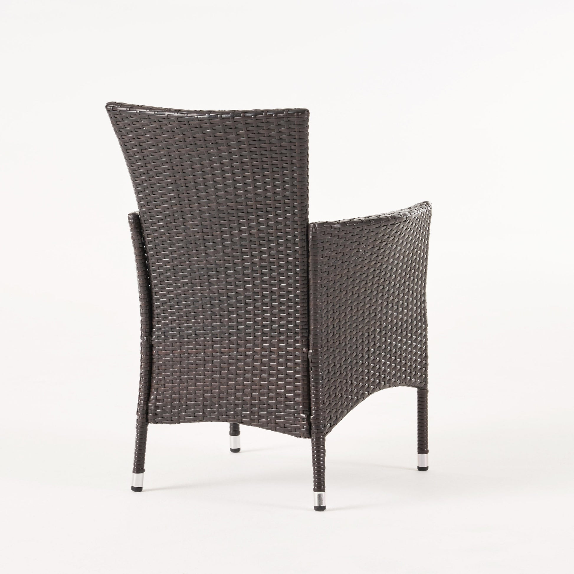 Dark brown rattan patio chair with woven seat and back silver feet