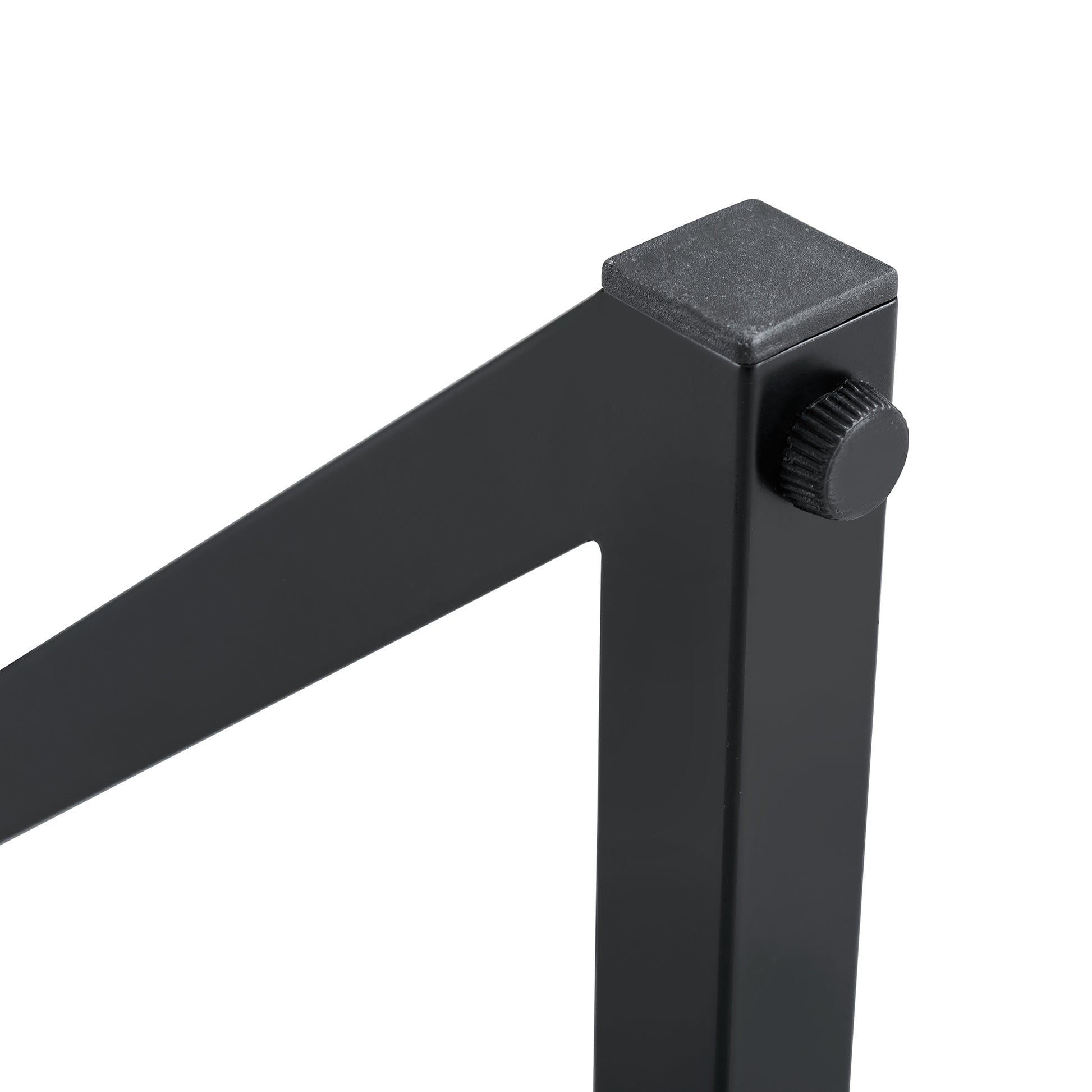 Closeup of black metal furniture leg with textured foot and screw detail
