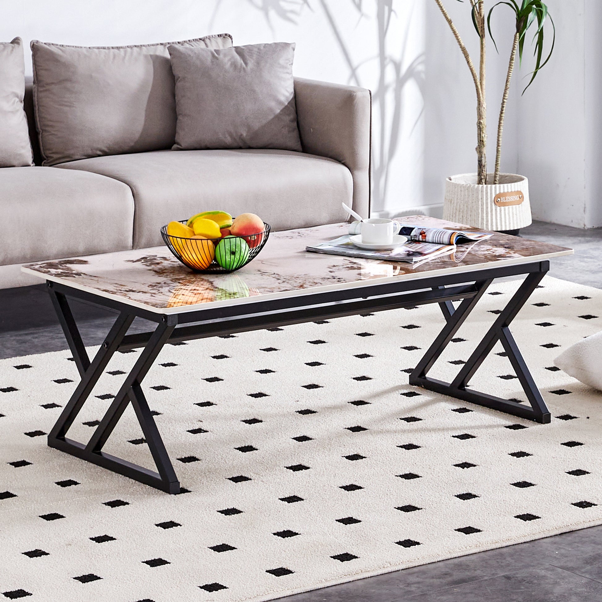 Glass top coffee table with marble pattern and black metal base perfect for modern living rooms