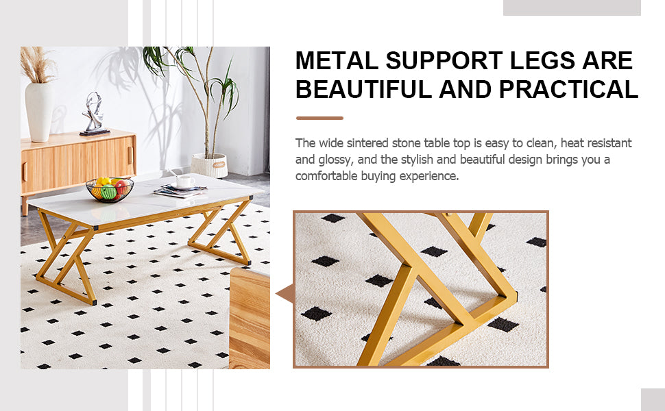 White sintered stone coffee table with gold metal Xframe legs on a patterned rug