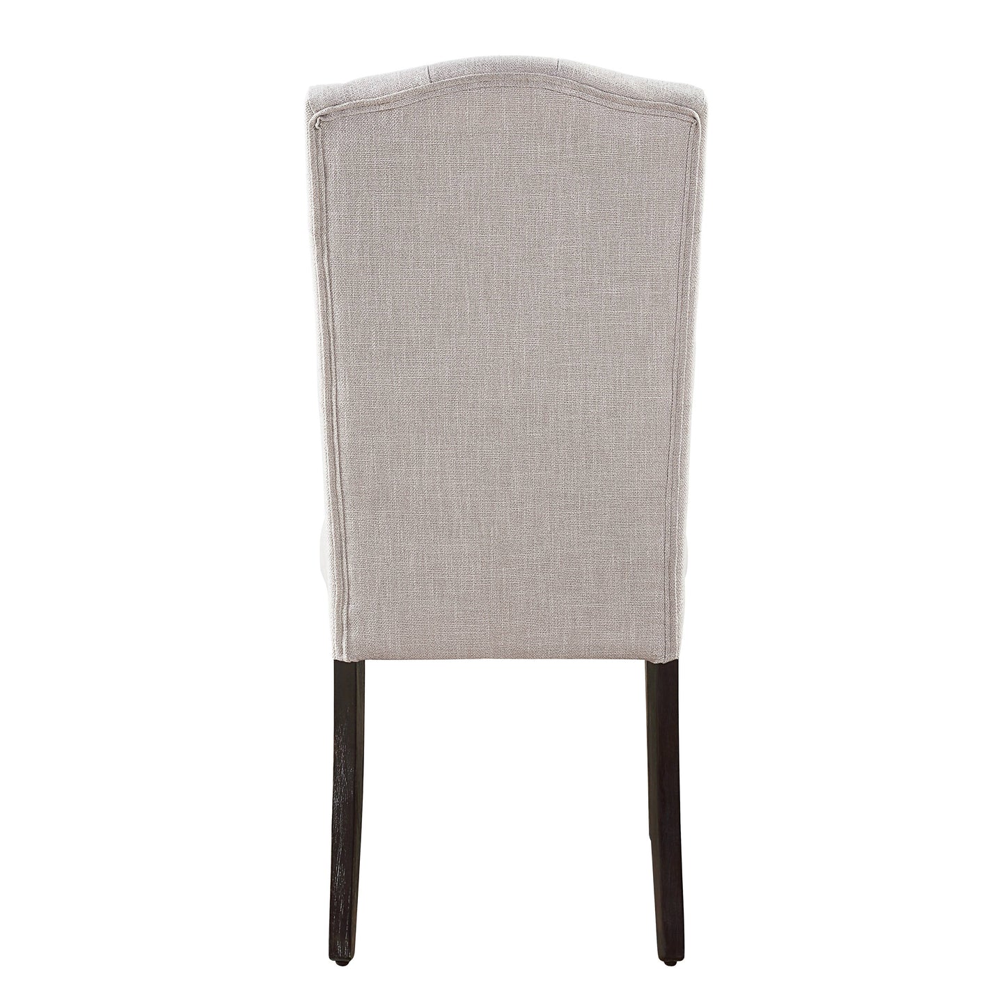 Tufted beige linen dining chair with dark wood legs seen from the back