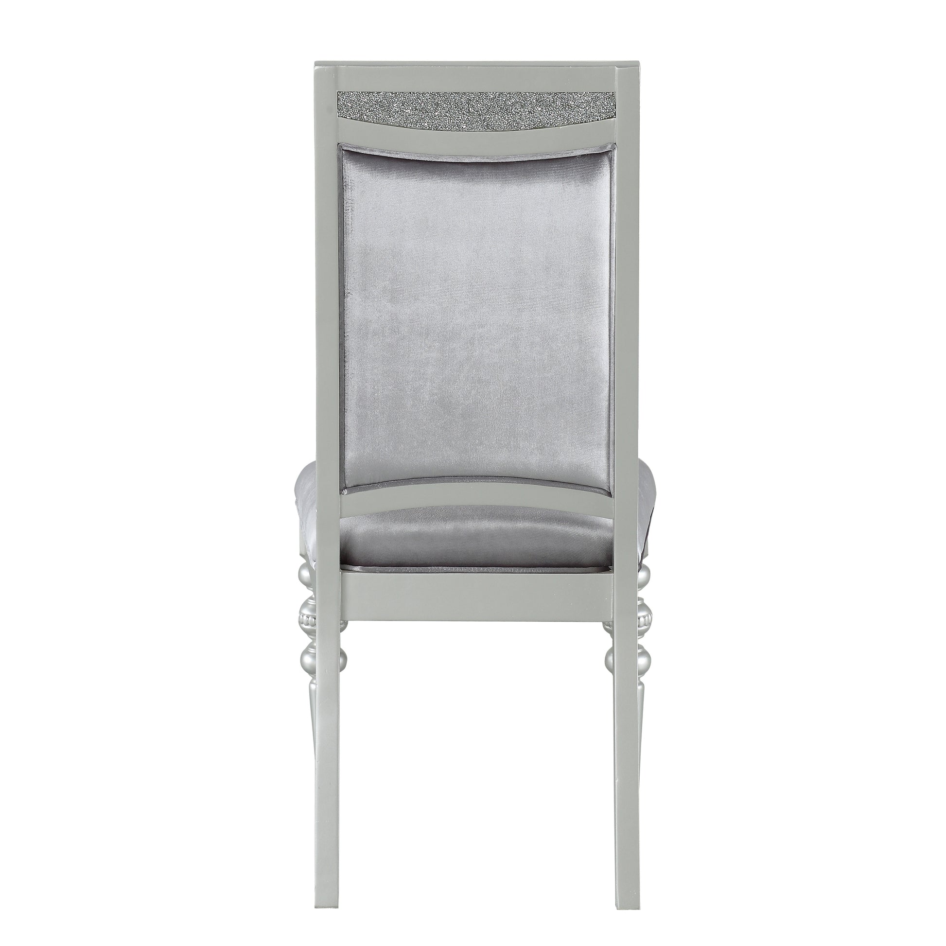 Silver velvet dining chair with crystalencrusted back detail and ornate legs