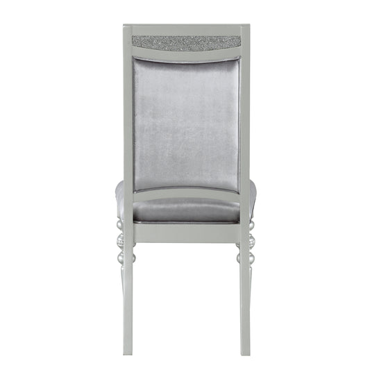 Silver velvet dining chair with crystalencrusted back detail and ornate legs