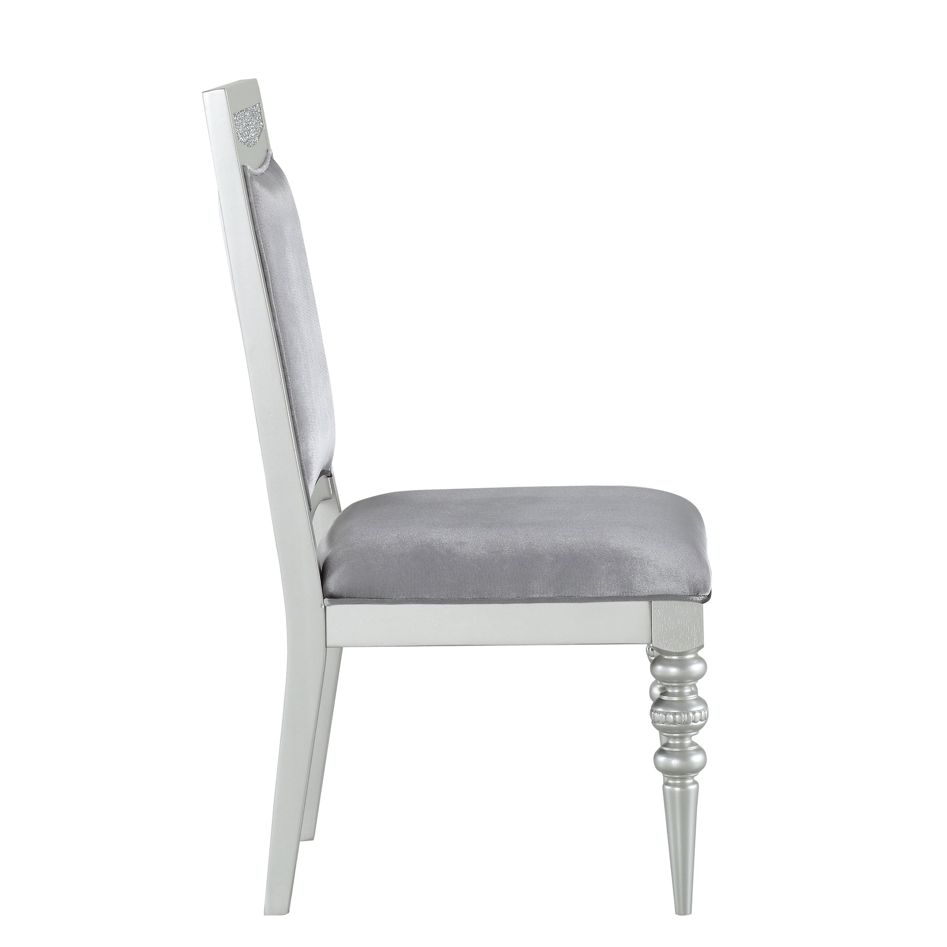 Silver velvet upholstered dining chair with ornate silver wood frame and carved leg