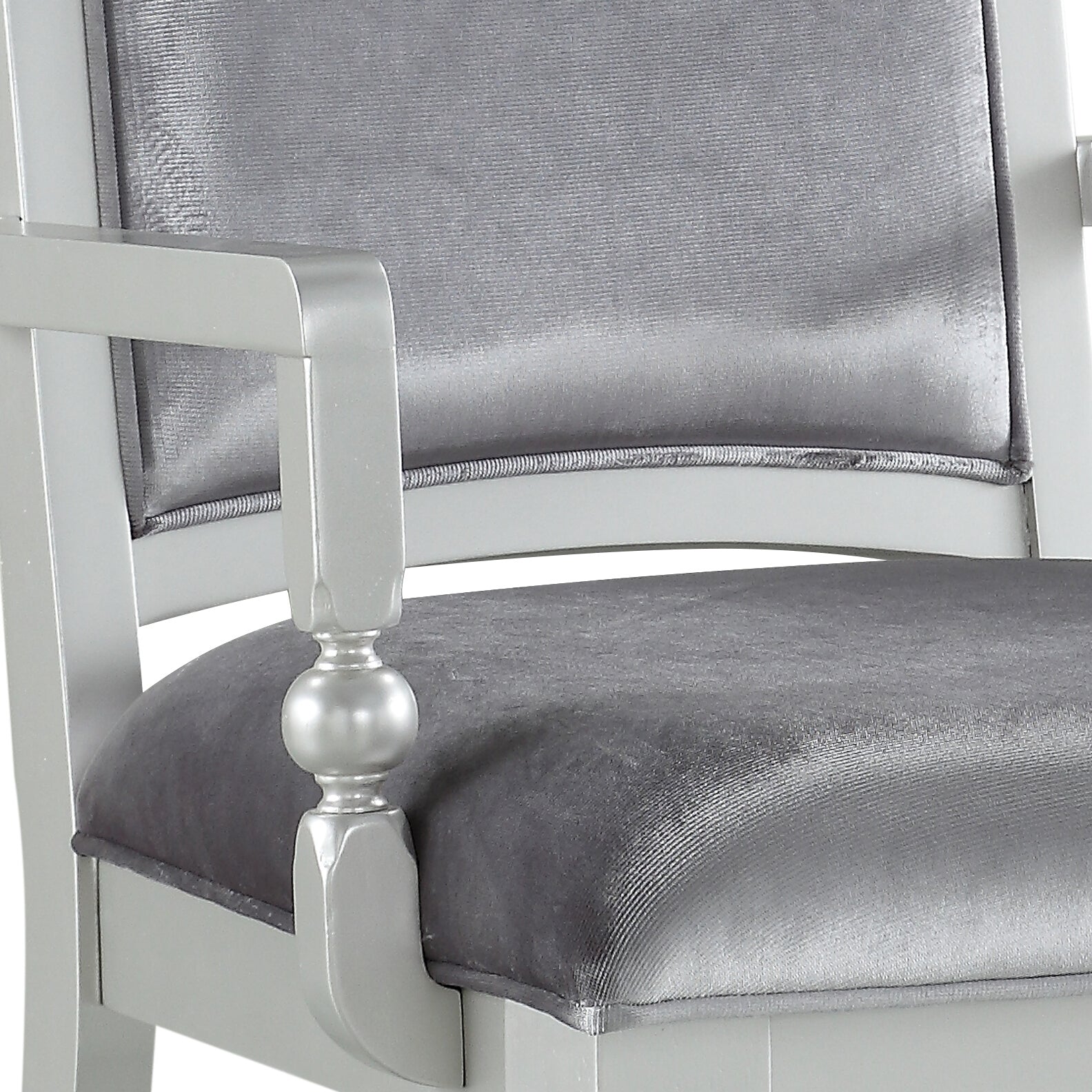 Silver upholstered armchair with detailed armrest and padded seat