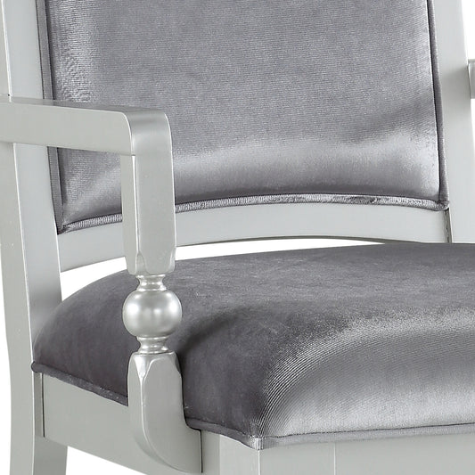 Silver upholstered armchair with detailed armrest and padded seat