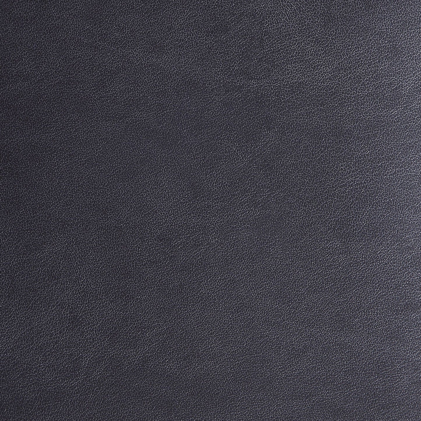 Closeup of dark gray textured vegan leather fabric surface