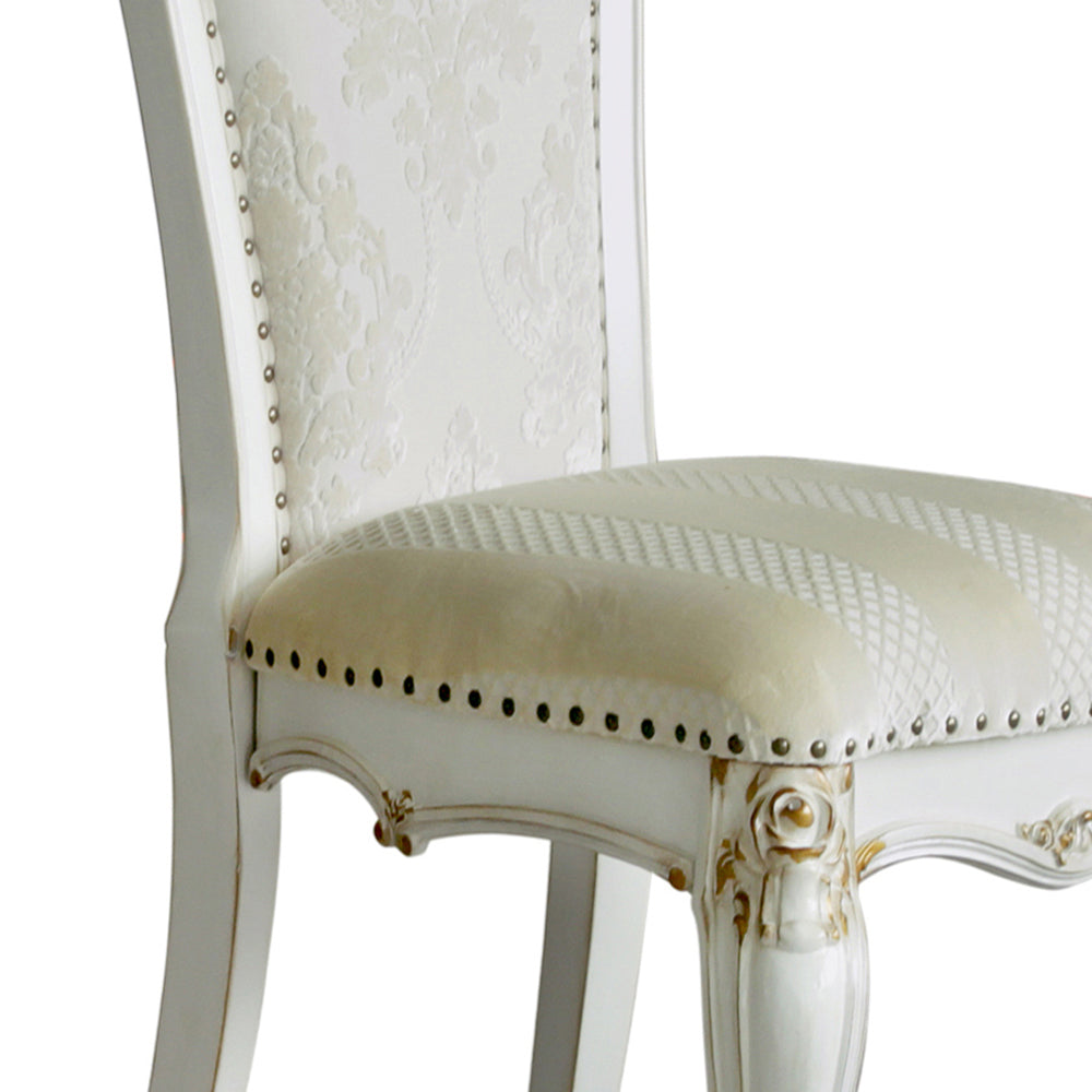 Elegant white upholstered dining chair with damask pattern