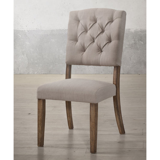 Tufted back linen dining chair in beige with distressed wooden legs and a modern farmhouse style