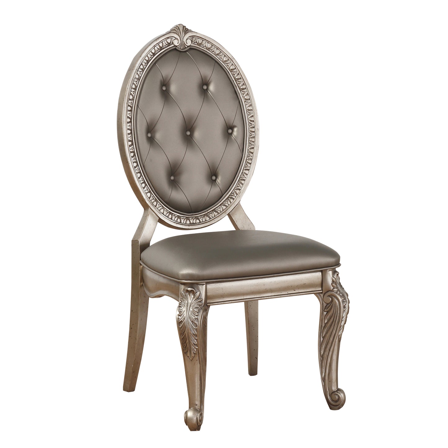 Ornate silver dining chair with tufted grey upholstery and carved details