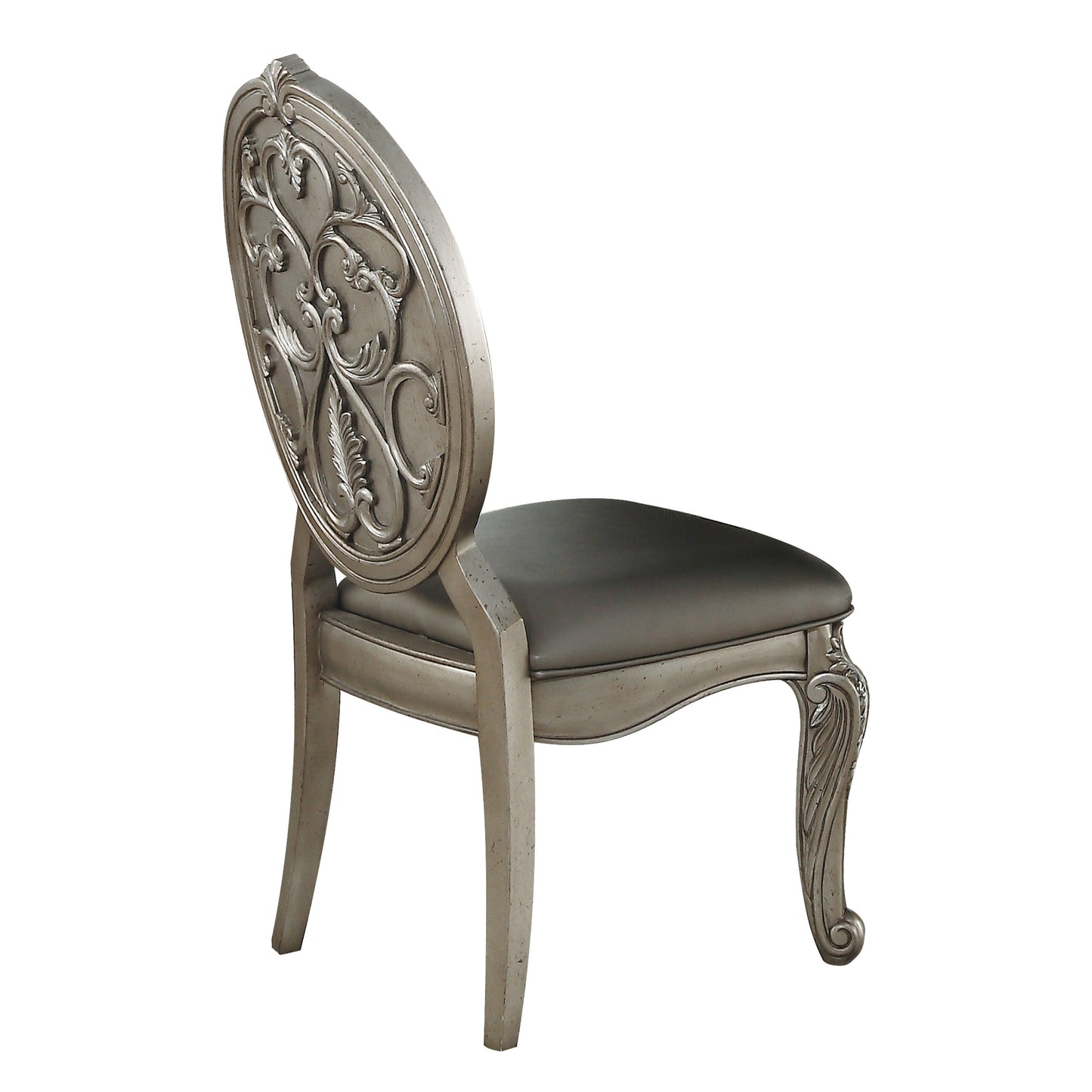 Antique silver dining chair with ornate carved back and upholstered seat