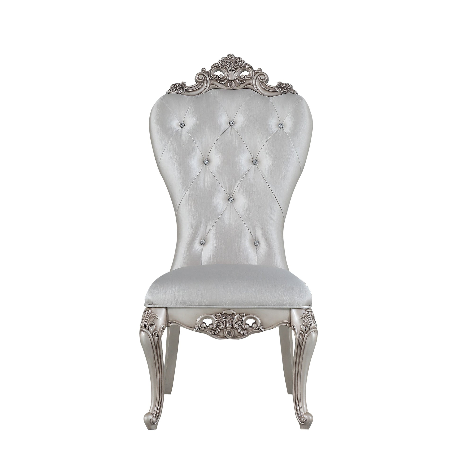 Silver tufted dining chair with ornate carved legs