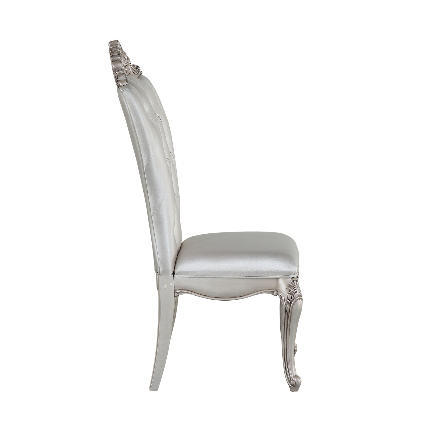 Ornate silver upholstered dining chair with tufted back and scrolled legs