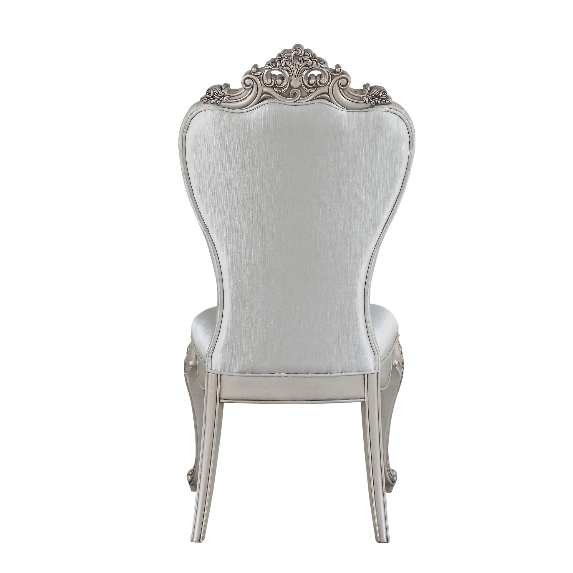 Ornate silver accent chair with upholstered seat and decorative carved crest detail