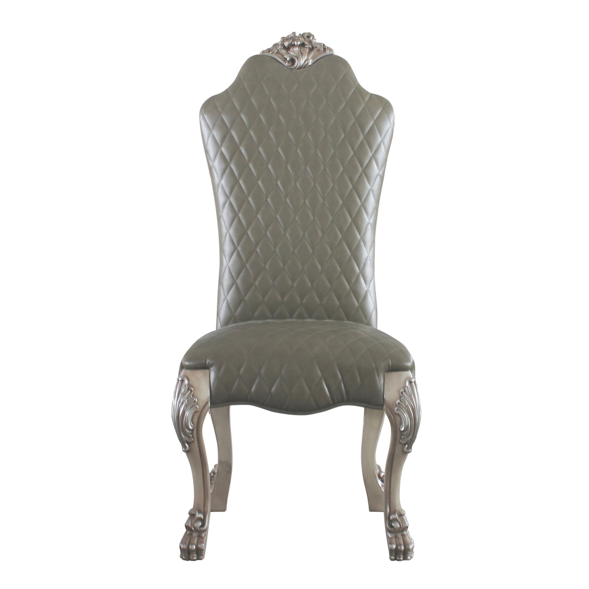 Elegant grey tufted upholstered dining chair with ornate silver carved legs