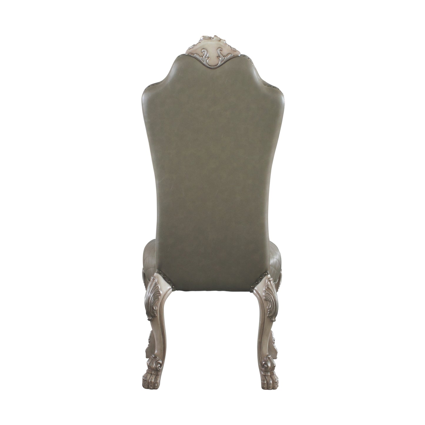 Back view of a grey tufted leather dining chair with ornate carved wooden legs