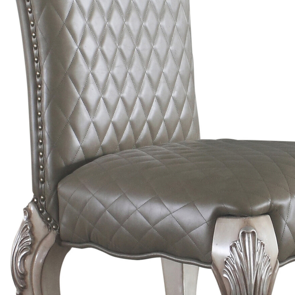 Diamondtufted taupe faux leather dining chair with silver nailhead trim
