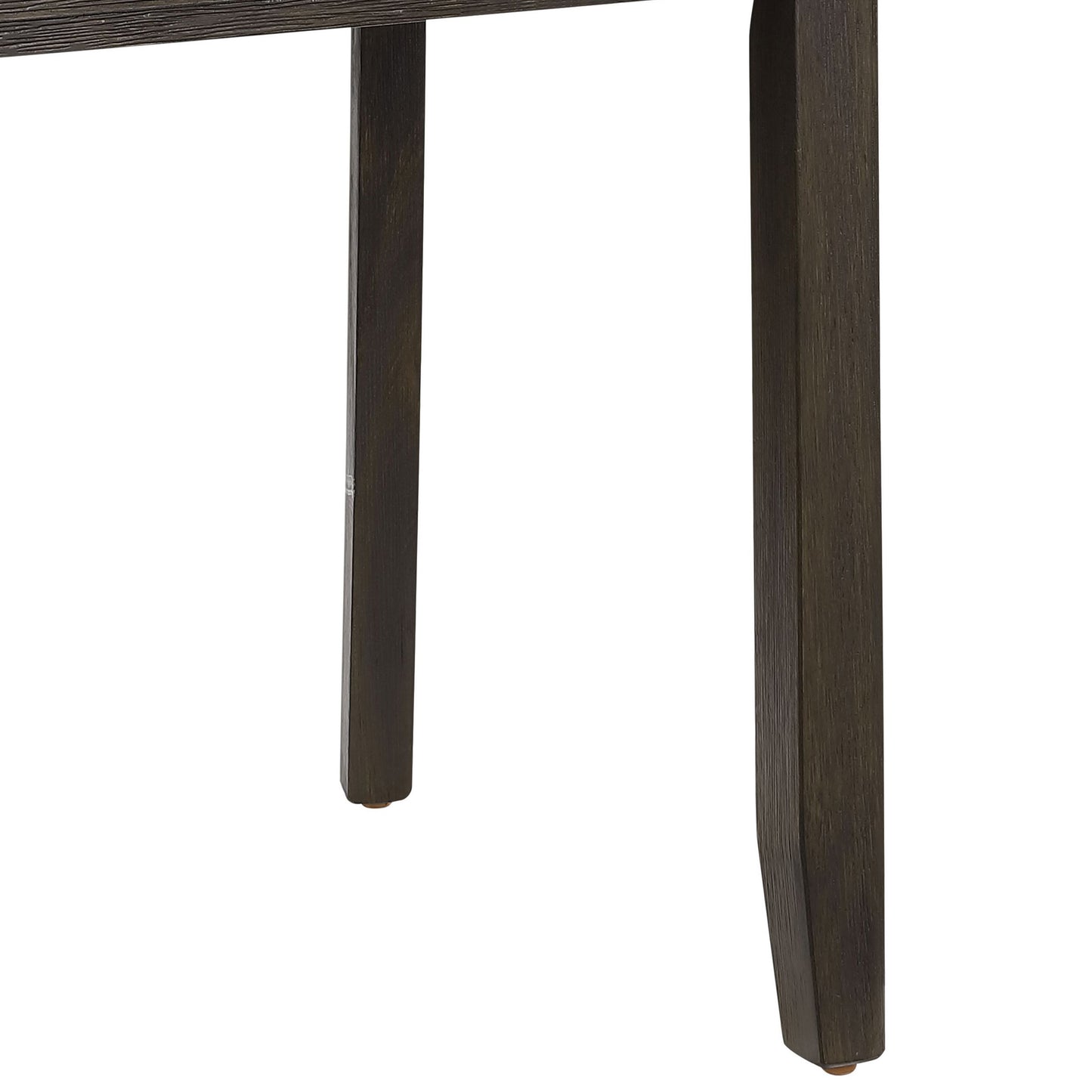 Dark oak wood dining table legs with textured grain and brass foot caps