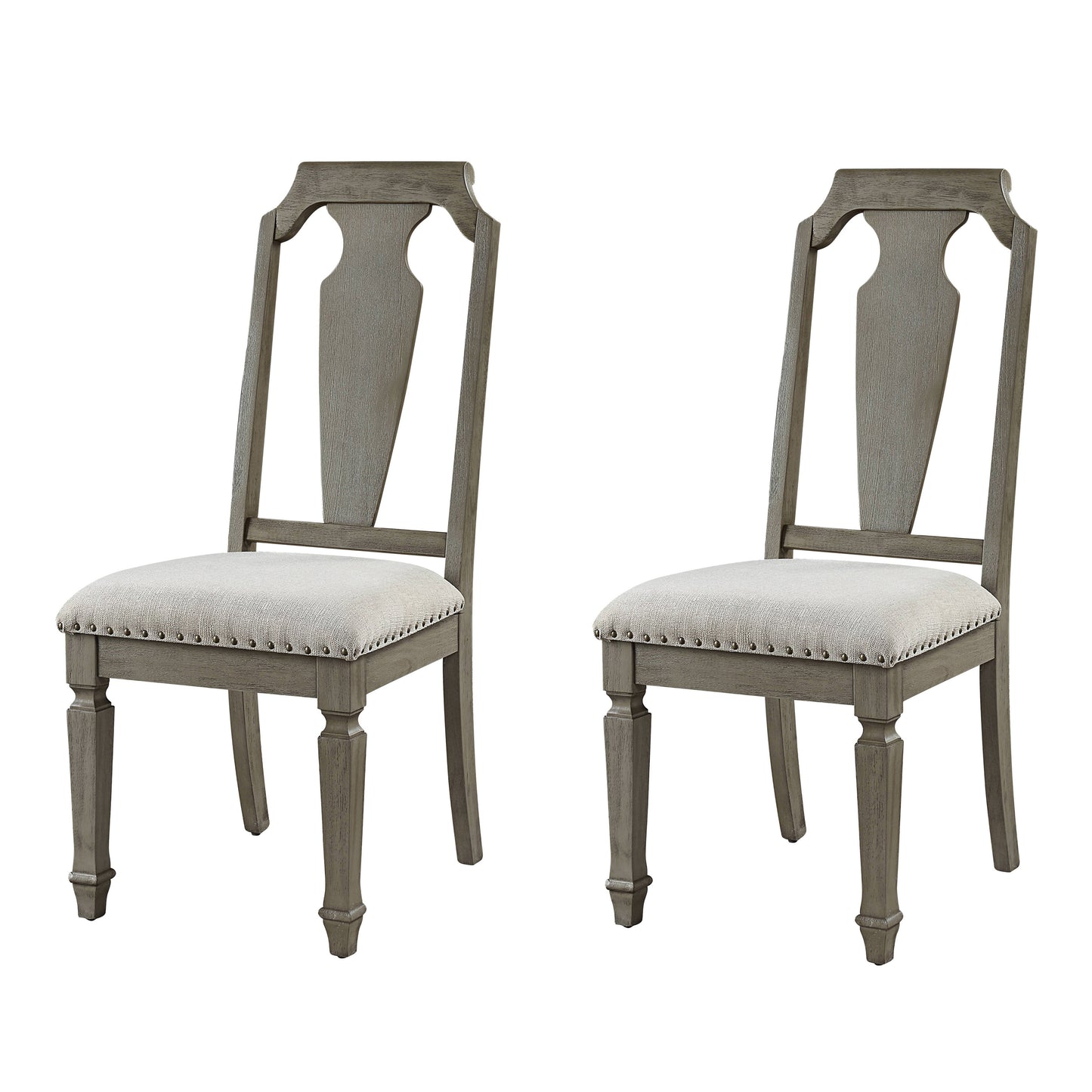 Two distressed gray wooden dining chairs with beige upholstered seats and nailhead trim