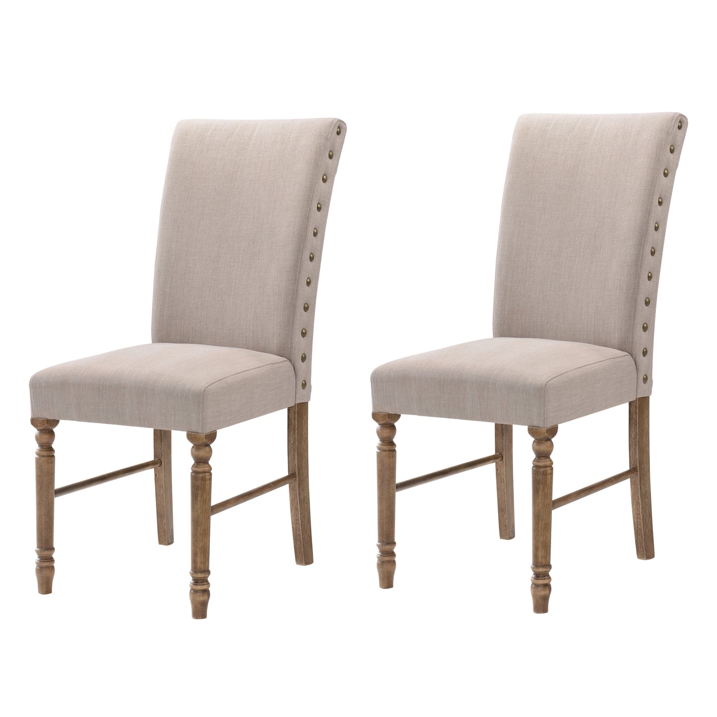 Pair of beige linen dining chairs with nailhead trim and turned wood legs