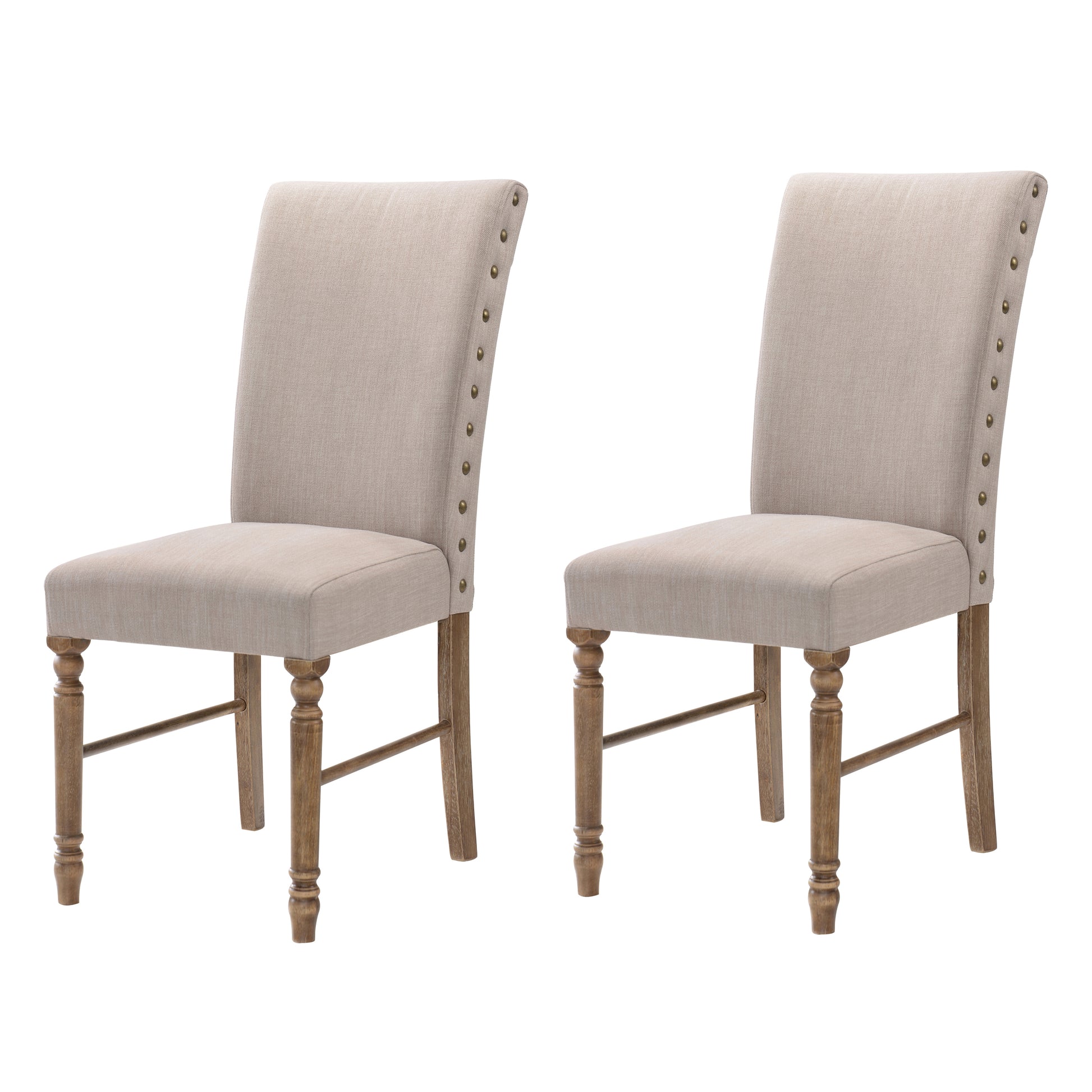 Pair of beige linen dining chairs with nailhead trim and turned wood legs