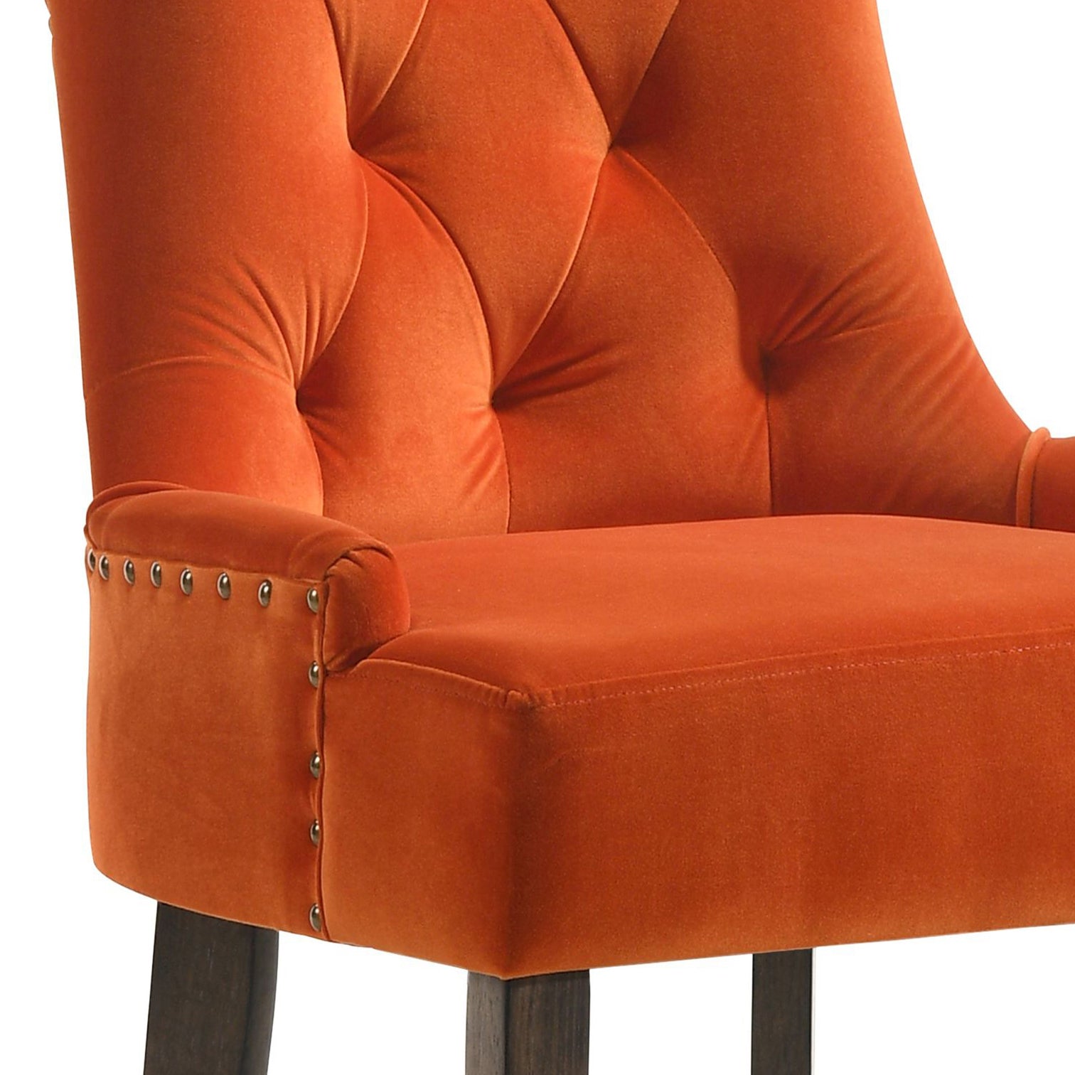 Orange velvet bar stool with tufted back and silver nailhead trim