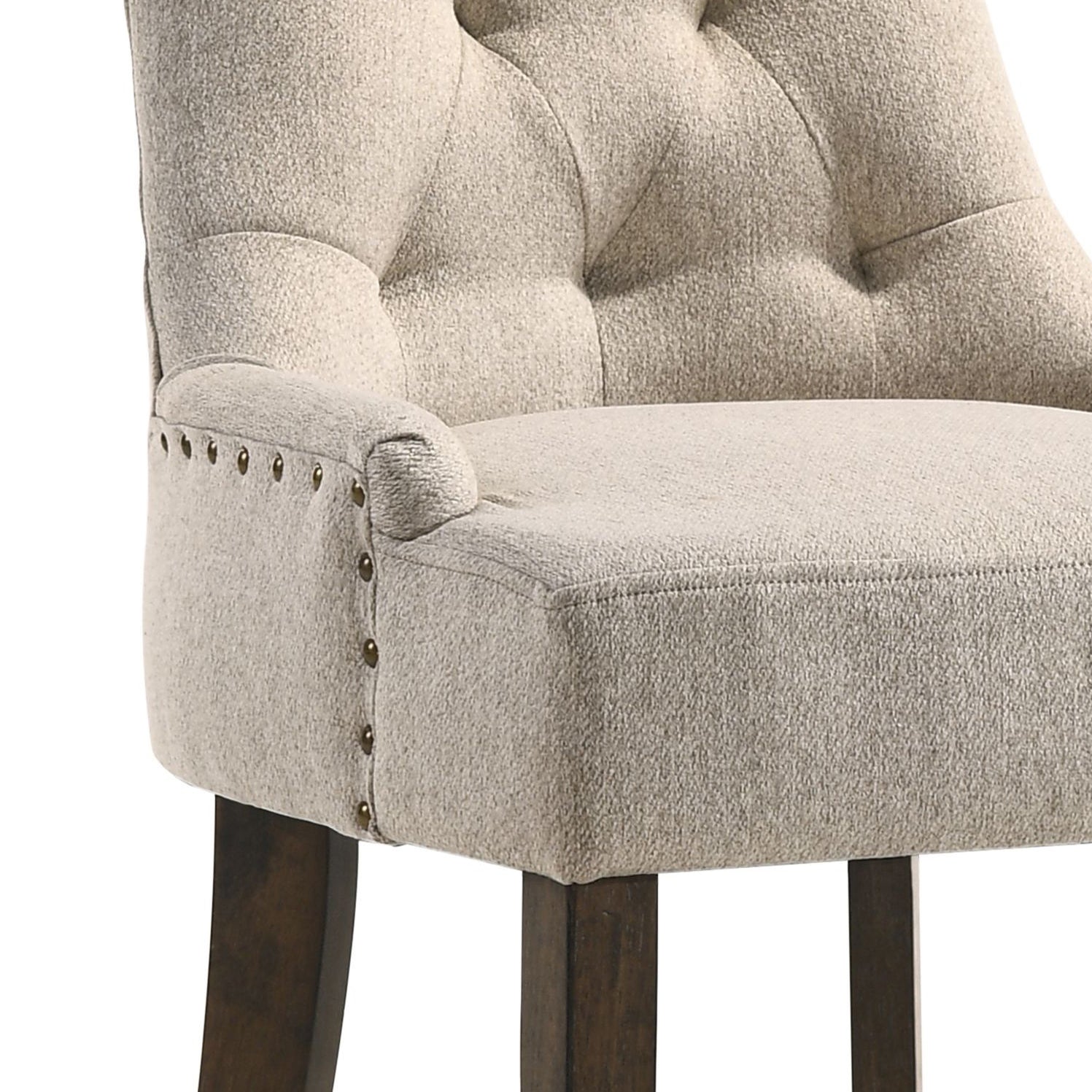 Tufted back light beige fabric accent chair with antique brass nailhead trim