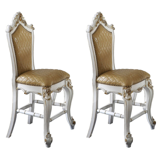 Two ornate gold tufted bar stools with white carved wood frames