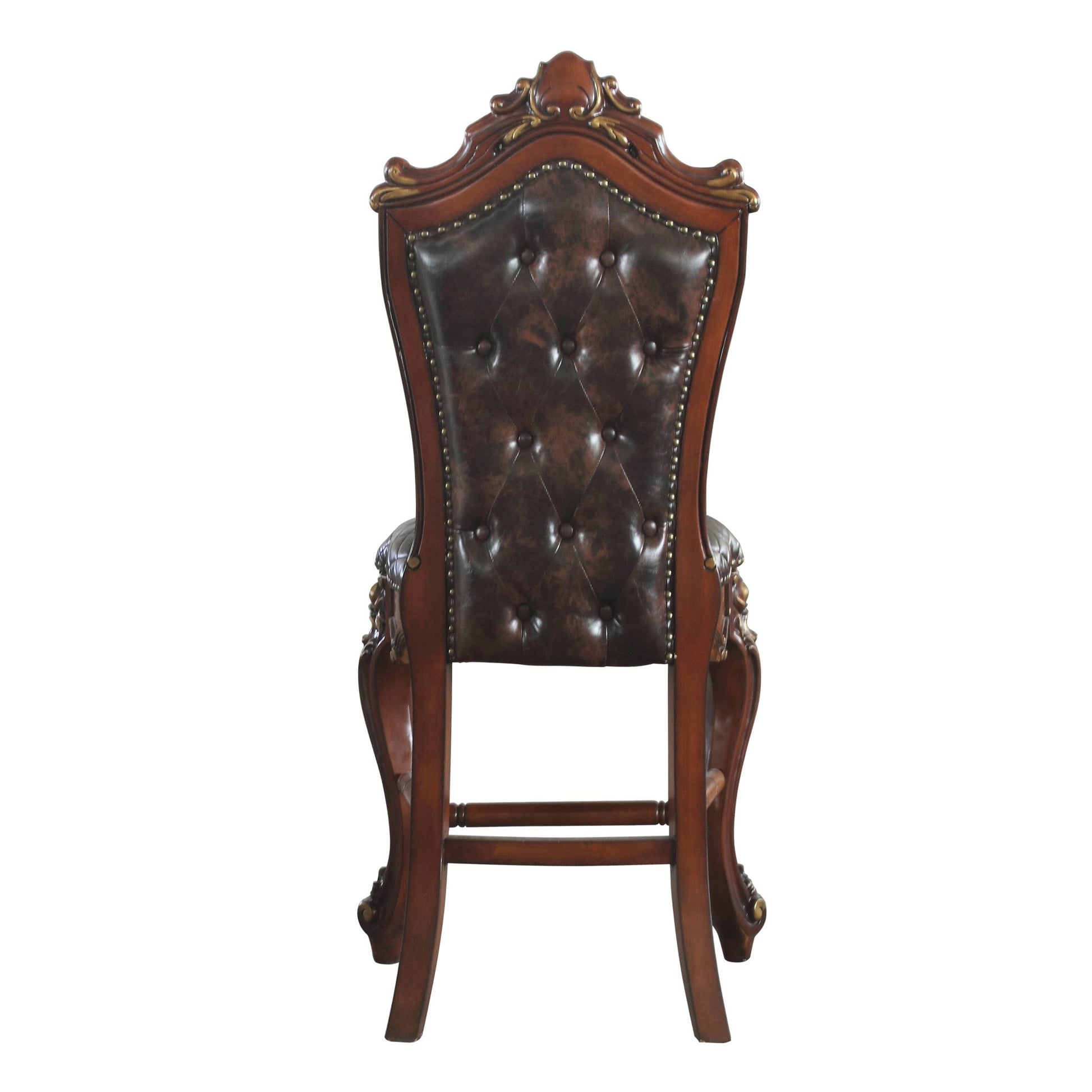 Luxury tufted armchair with dark brown leather upholstery and ornate mahogany wood frame
