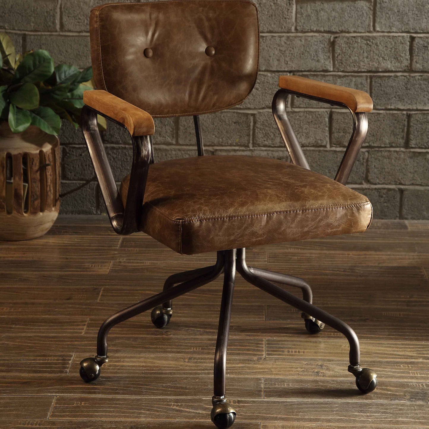 Distressed brown leather office chair with tufted back metal base and wooden armrests Industrial style