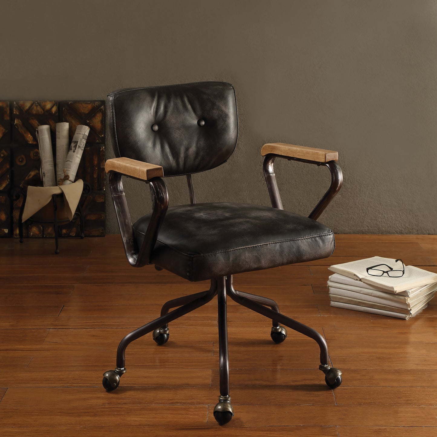 Vintage black leather office chair with wooden armrests and metal base