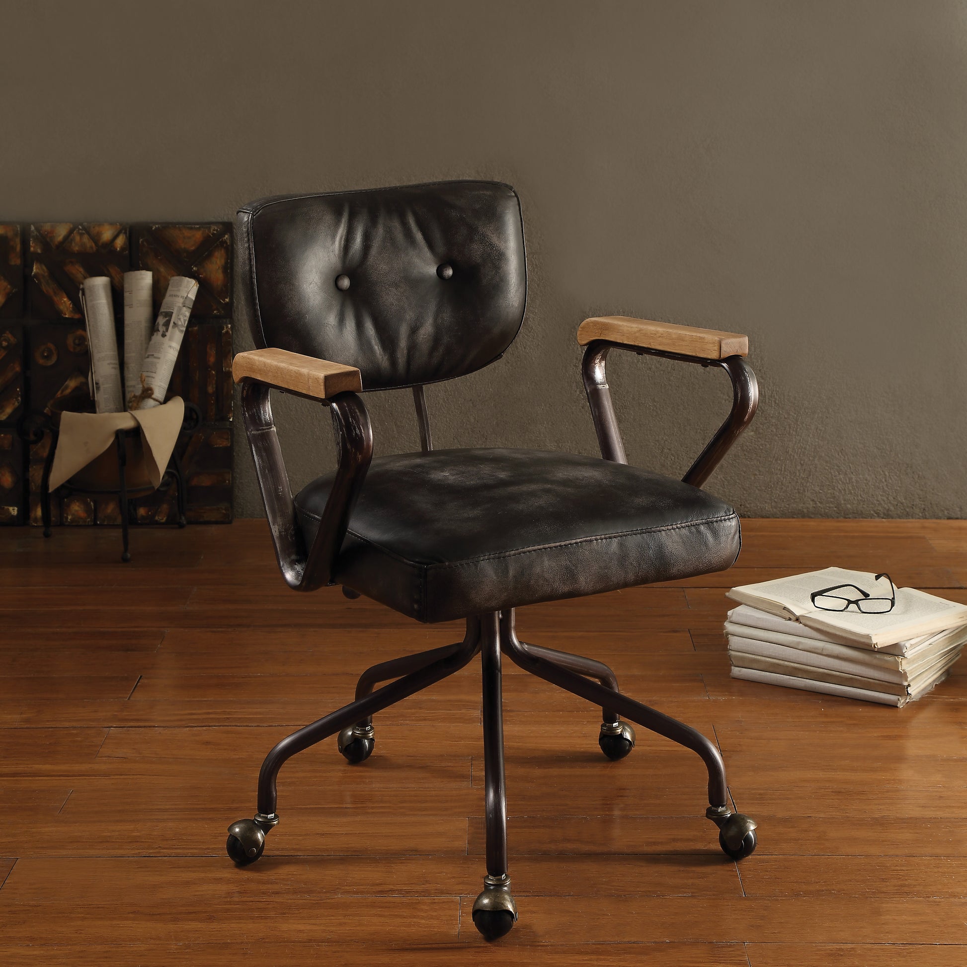 Vintage black leather office chair with wooden armrests and metal base