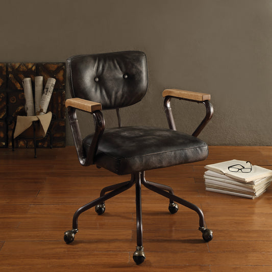 Vintage black leather office chair with wooden armrests and metal base