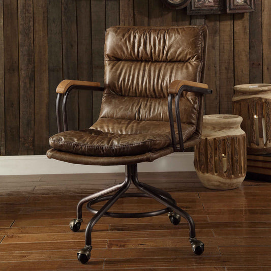 Brown distressed leather office chair with tufted seat and back metal base and wheels