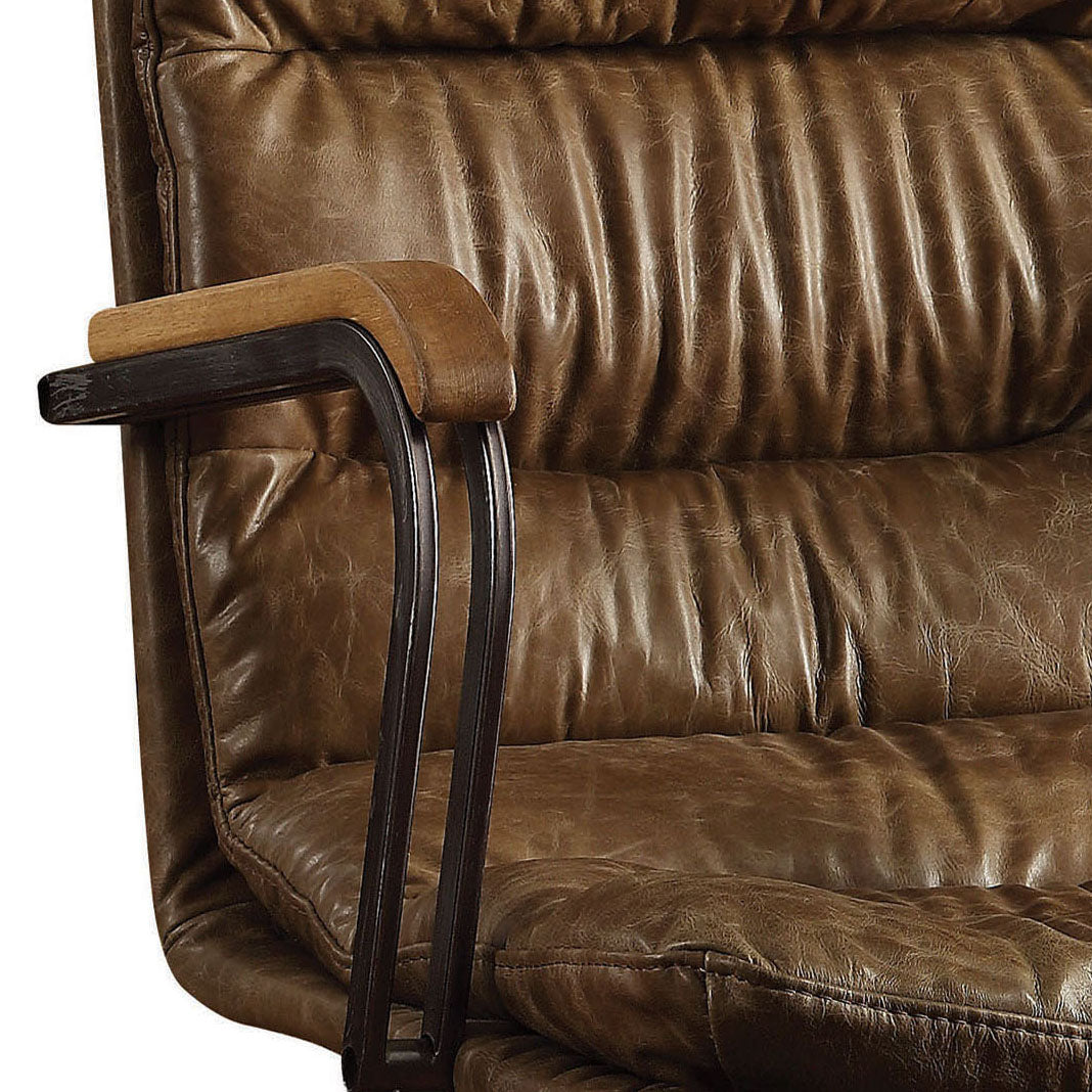 Closeup of plush brown leather office chair armrest with dark metal frame and wooden accent