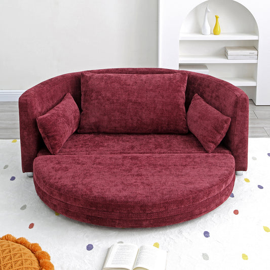 Round plush burgundy sofa with textured fabric and accent pillows for a cozy living room