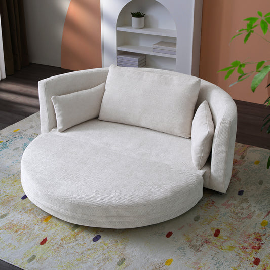 Plush cream circular accent chair with matching bolster and square pillows on textured rug