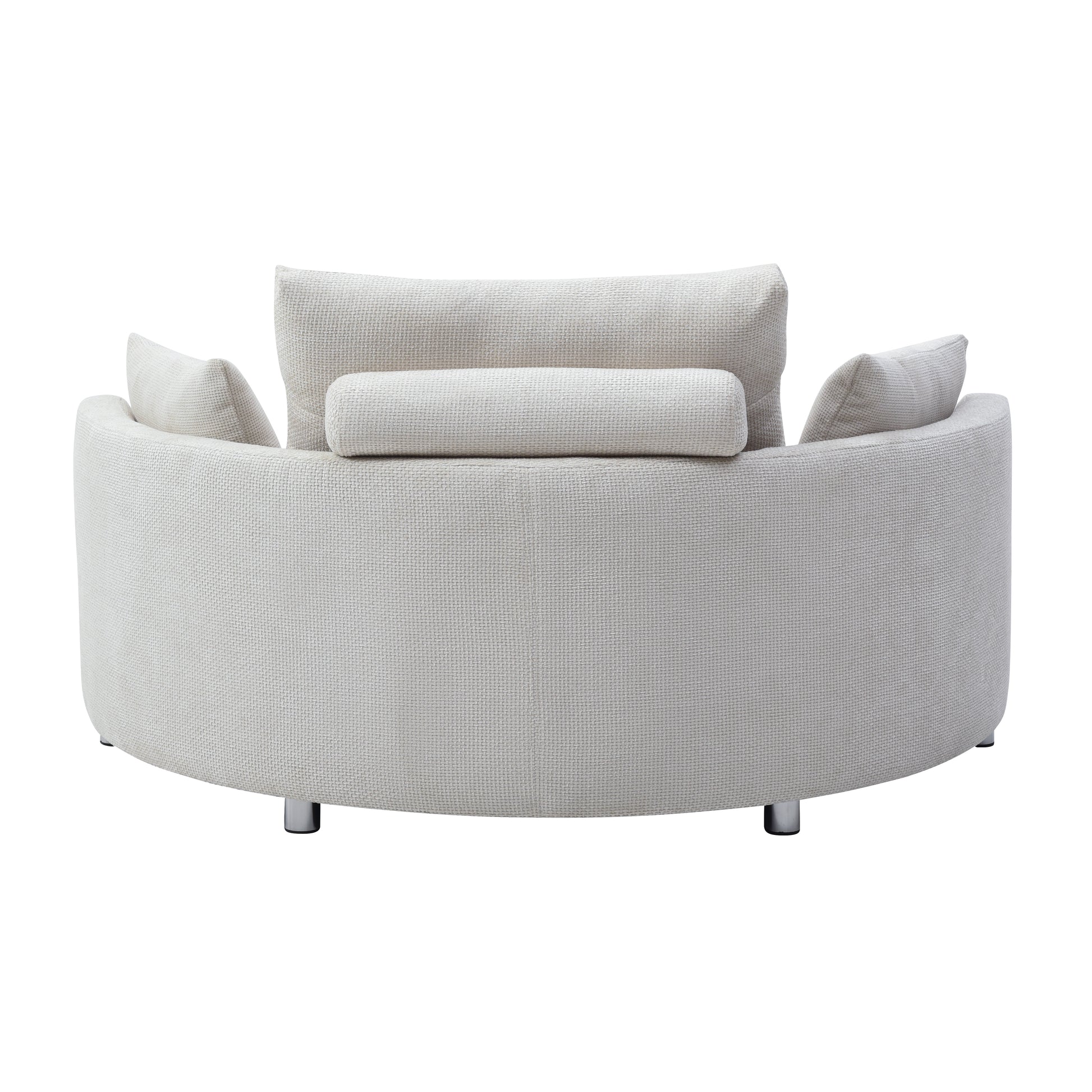 Curved cream fabric armchair with plush back cushions and silver legs