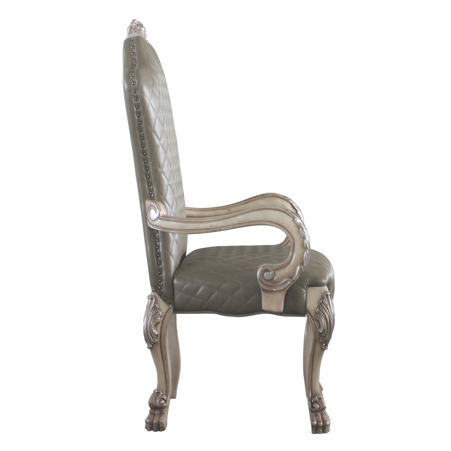 Ornate carved wood and quilted taupe leather dining chair with studded trim