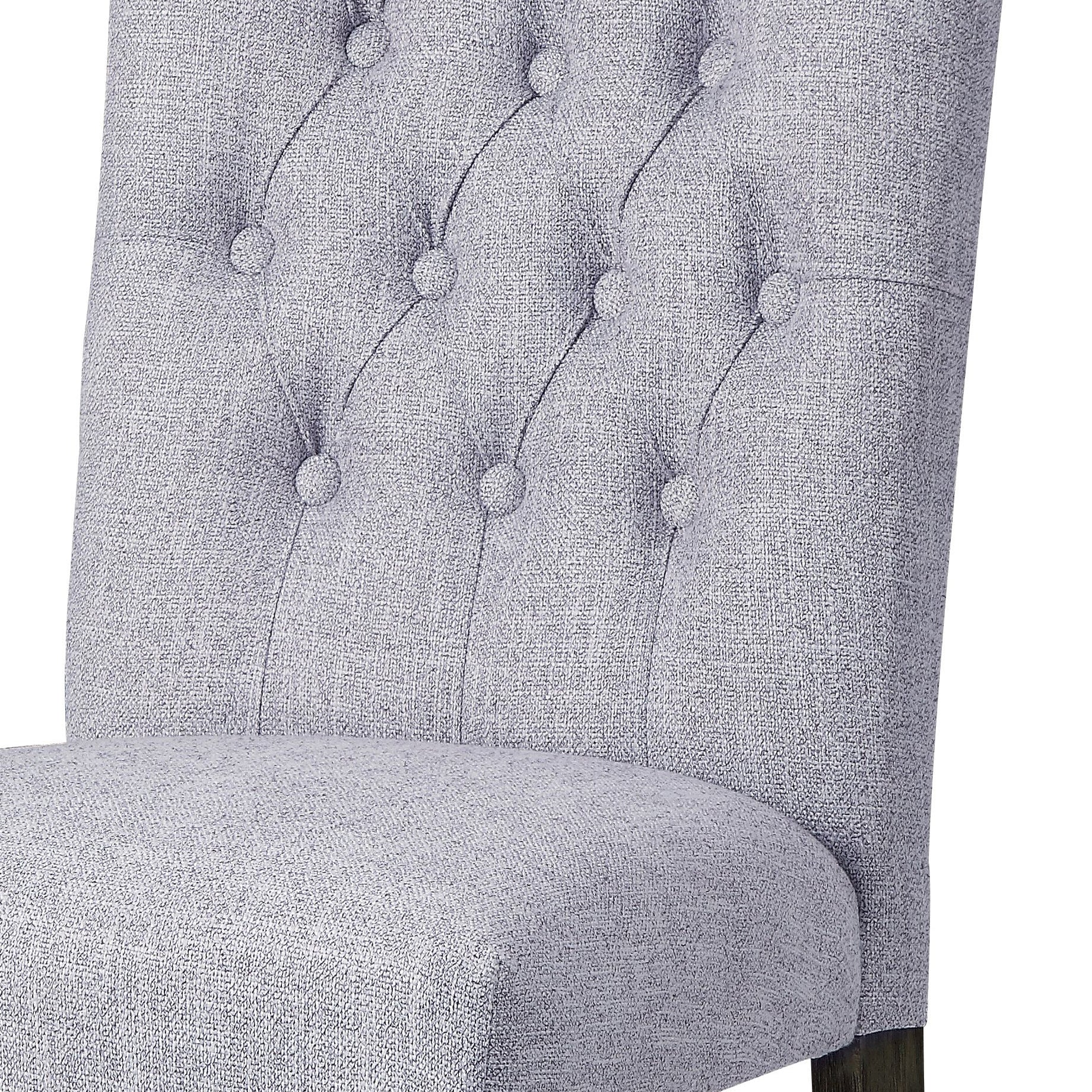 Light grey tufted fabric dining chair with diamond stitching detail