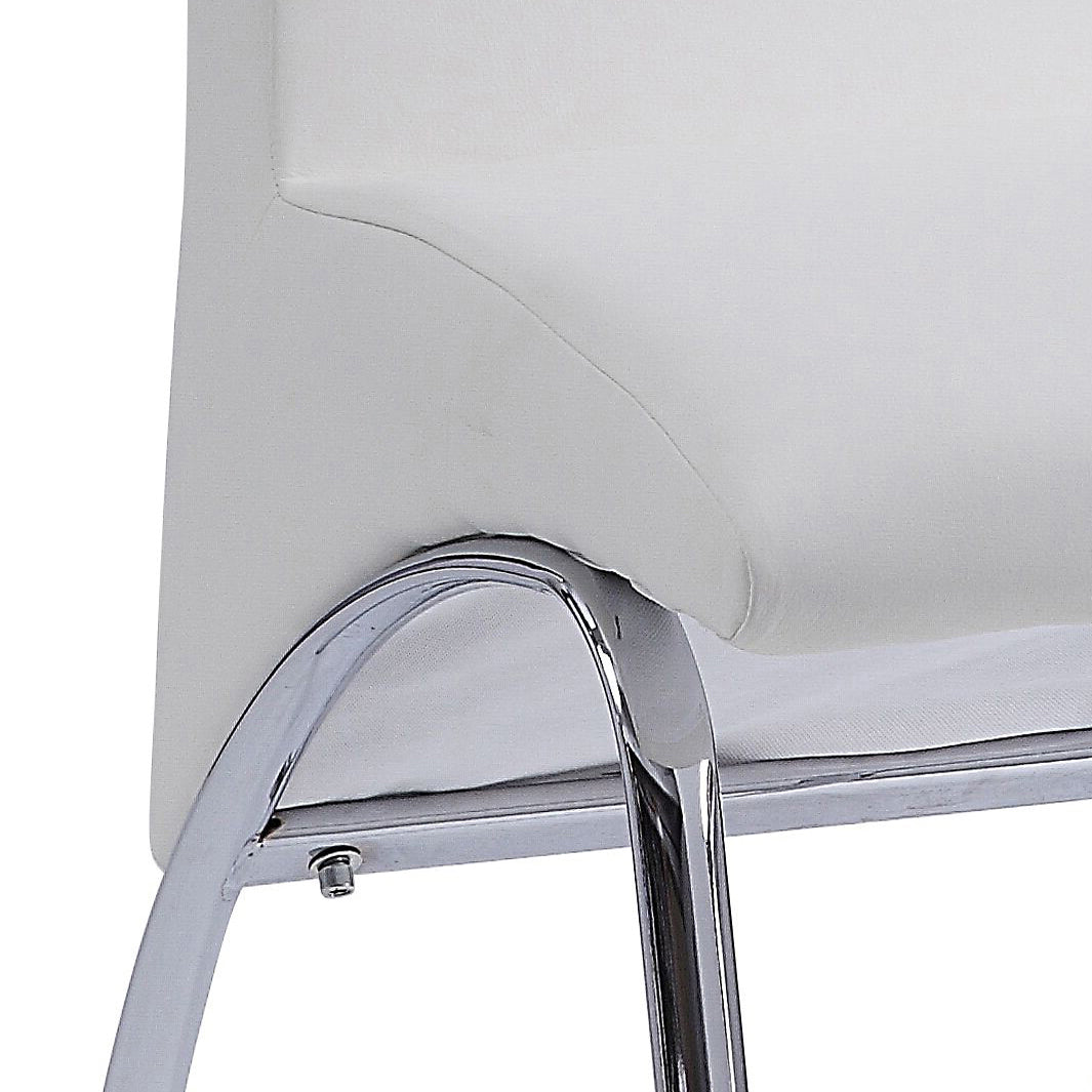 Closeup of a white faux leather chair seat with polished chrome legs