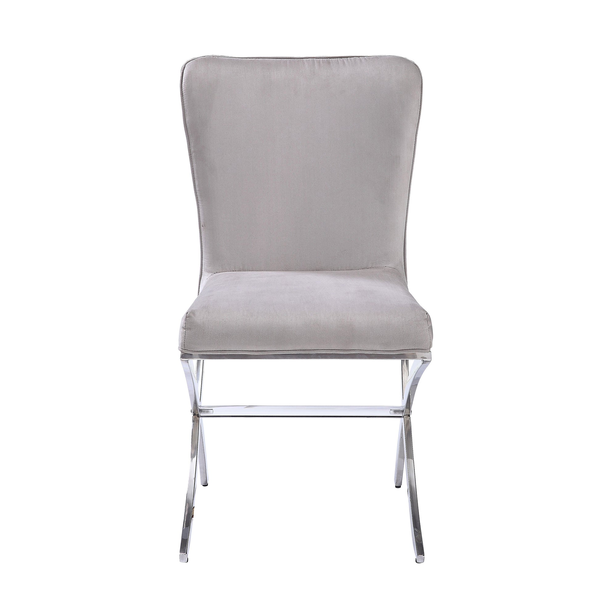 Elegant light grey velvet dining chair with polished chrome legs and subtle tufting on back