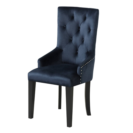Dark blue velvet dining chair with button tufting and silver nailhead trim