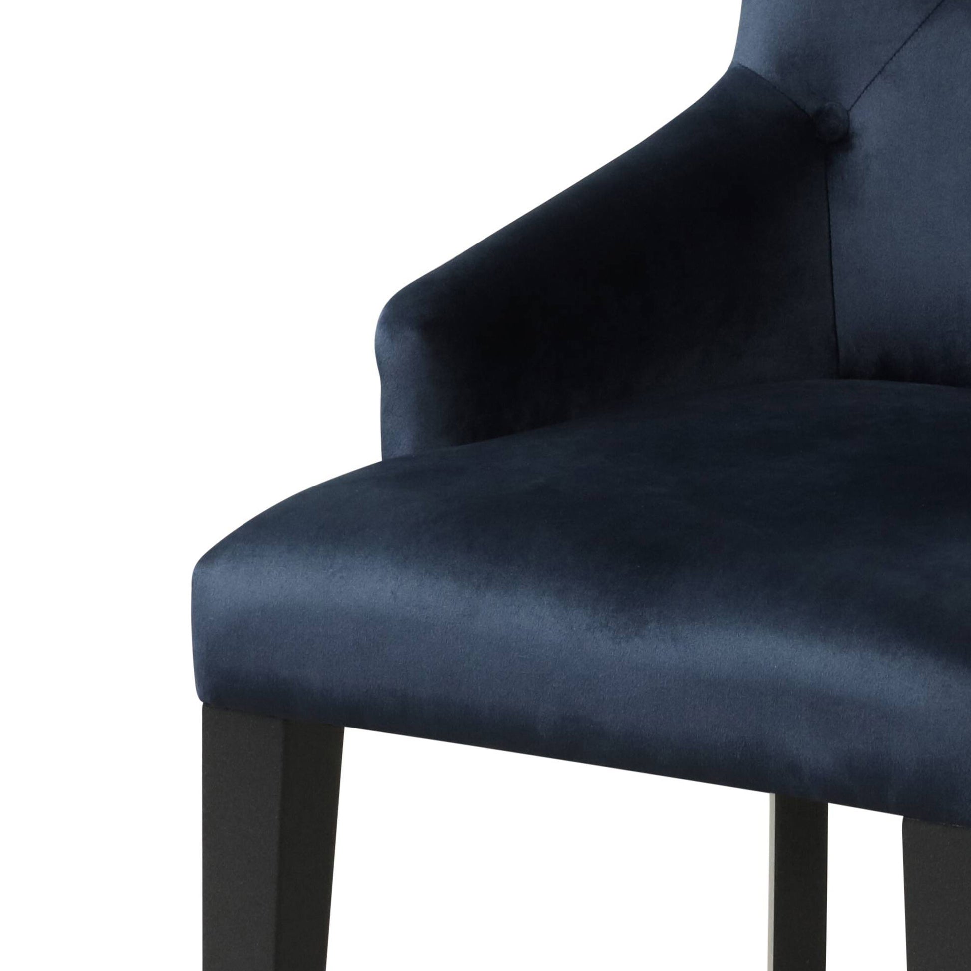 Navy blue velvet dining chair with button tufting detail