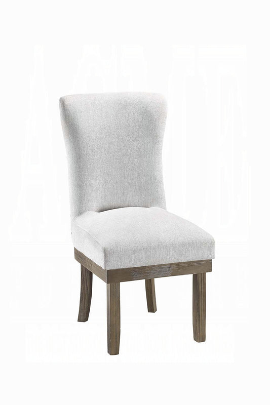 Upholstered dining chair in light gray fabric with a rustic wood base and tapered legs