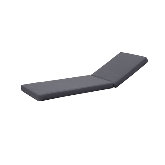 Dark grey tufted chaise lounge cushion with adjustable backrest for outdoor relaxation