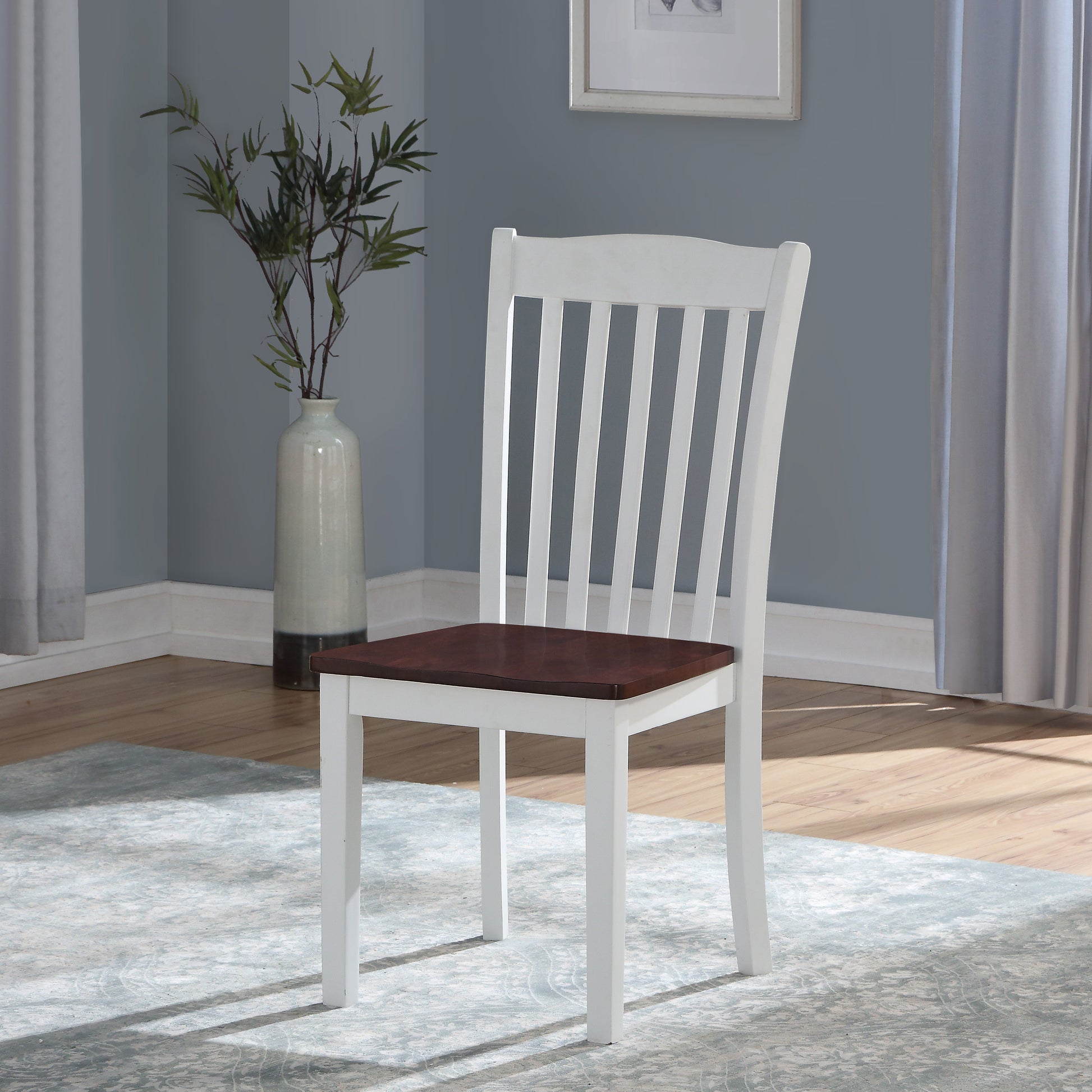 White wood dining chair with slatted back and dark wood seat modern design
